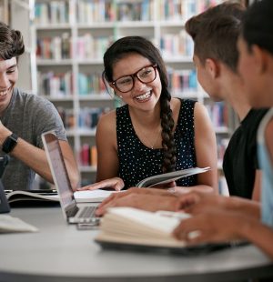 Group of students working in group & laughing